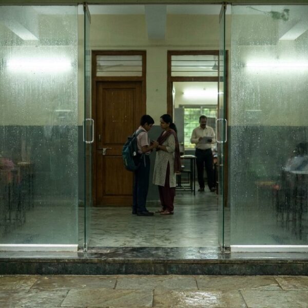 Parent and student outside an Indian coaching centre during Byju’s and Aakash uncertainty