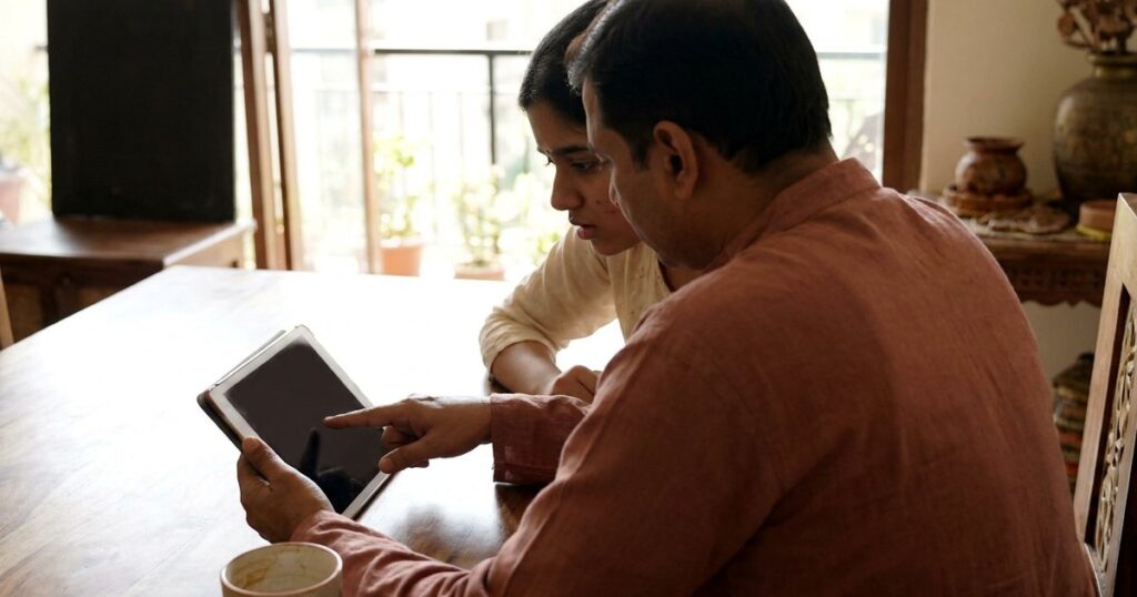 Parent and daughter review an ed-tech course loan before signing an EMI