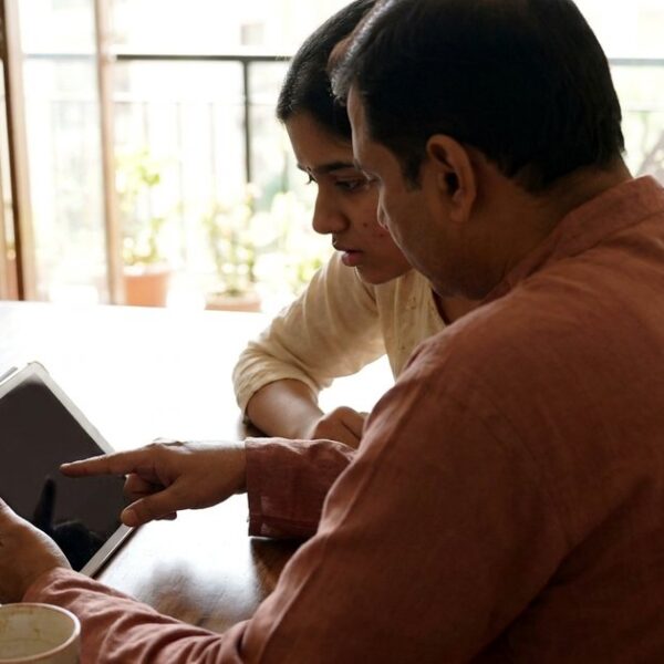 Parent and daughter review an ed-tech course loan before signing an EMI