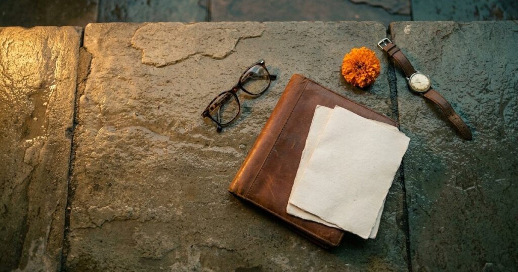 An overhead view shows a thoughtful arrangement symbolizing alternative job search methods, including a marigold flower and closed folder.