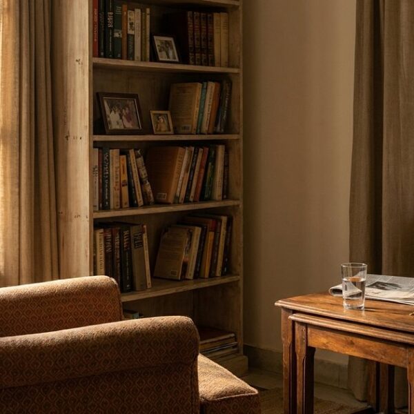 A cozy study room in India with a bookshelf and armchair, highlighting angel investing insights for Indian investors.