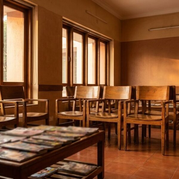 Empty IVF clinic waiting room with warm light, symbolizing patience in entrepreneurship.