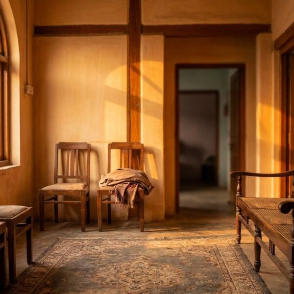 Warmly-lit Indian clinic waiting area with strong architectural lines, evoking parallels between startups and infertility struggles.