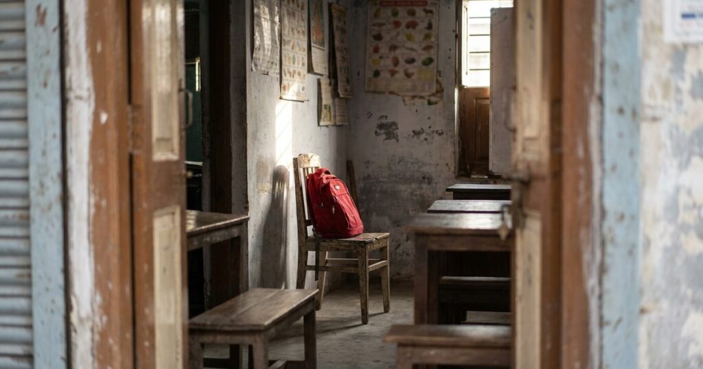 A tutoring center doorway scene embodies Byju's collapse, capturing educational ambition and challenges in India.
